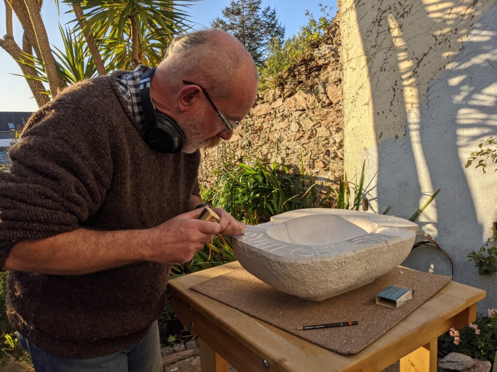 Working on my stone bowl inscription